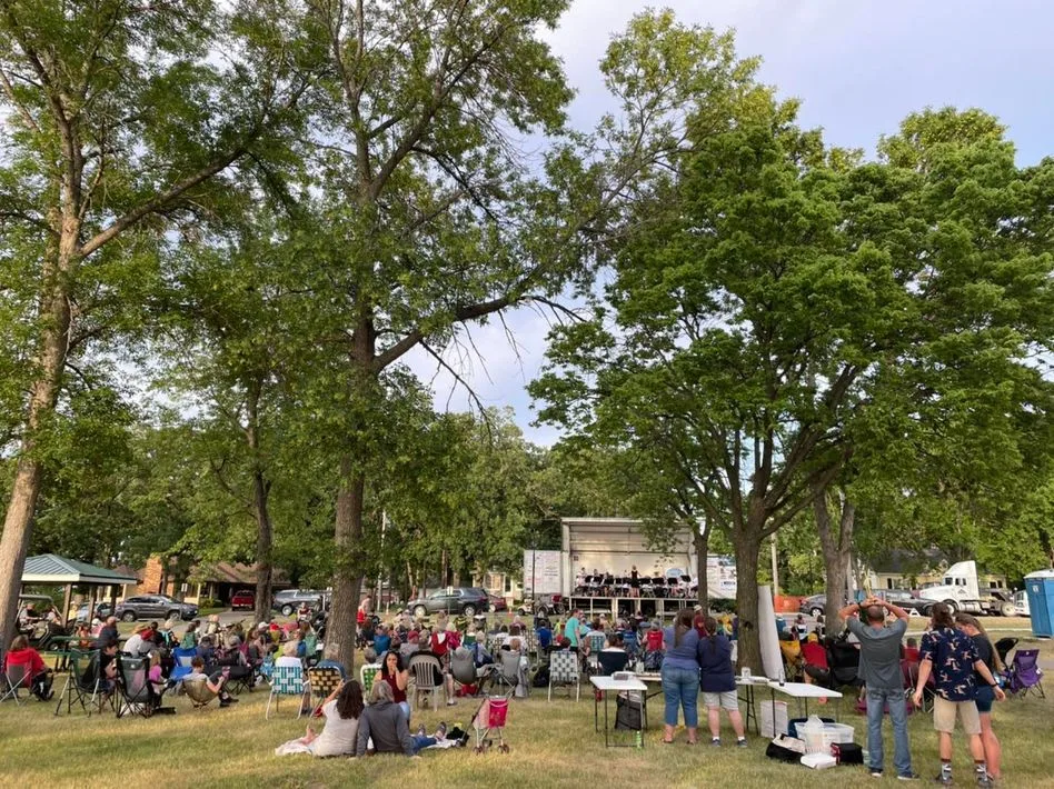 A summer evening concert crowd in an Annandale park